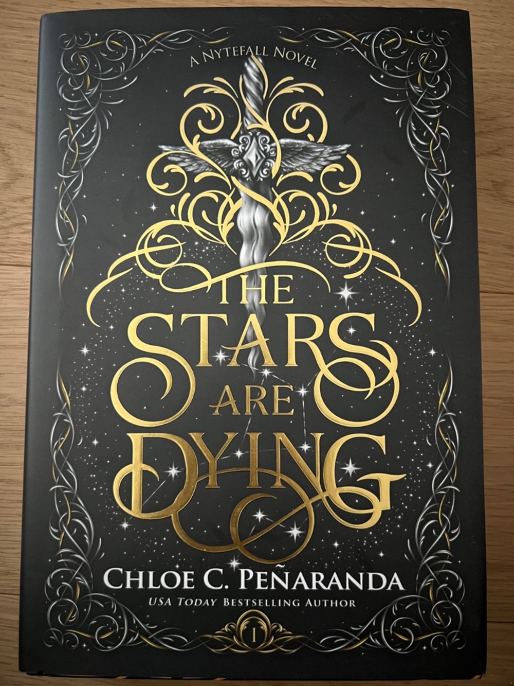 The Stars Are Dying by Chloe C. Peñaranda - Black & Gold Hardcover